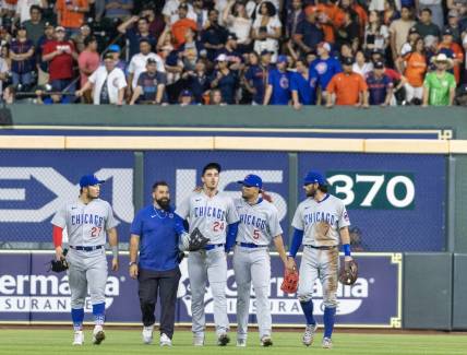 May 15, 2023; Houston, Texas, USA;  Chicago Cubs center fielder Cody Bellinger (24) comes out of the game after making a catch against the wall against the Houston Astros in the seventh inning at Minute Maid Park. Mandatory Credit: Thomas Shea-USA TODAY Sports