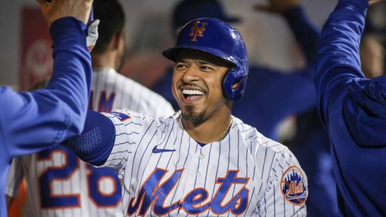 May 16, 2023; New York City, New York, USA; New York Mets third baseman Eduardo Escobar (10) is greeted in the dugout after hitting a pinch hit two run home run in the ninth inning against the Tampa Bay Rays at Citi Field. Mandatory Credit: Wendell Cruz-USA TODAY Sports