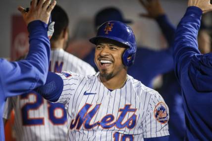May 16, 2023; New York City, New York, USA; New York Mets third baseman Eduardo Escobar (10) is greeted in the dugout after hitting a pinch hit two run home run in the ninth inning against the Tampa Bay Rays at Citi Field. Mandatory Credit: Wendell Cruz-USA TODAY Sports