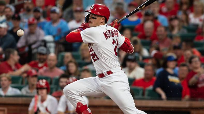 May 17, 2023; St. Louis, Missouri, USA; St. Louis Cardinals center fielder Lars Nootbaar (21) makes contact with the ball in the fourth inning at Busch Stadium. Mandatory Credit: Paul Halfacre-USA TODAY Sports