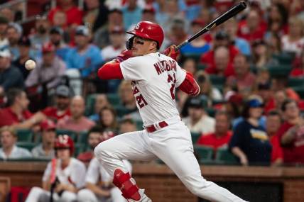 May 17, 2023; St. Louis, Missouri, USA; St. Louis Cardinals center fielder Lars Nootbaar (21) makes contact with the ball in the fourth inning at Busch Stadium. Mandatory Credit: Paul Halfacre-USA TODAY Sports