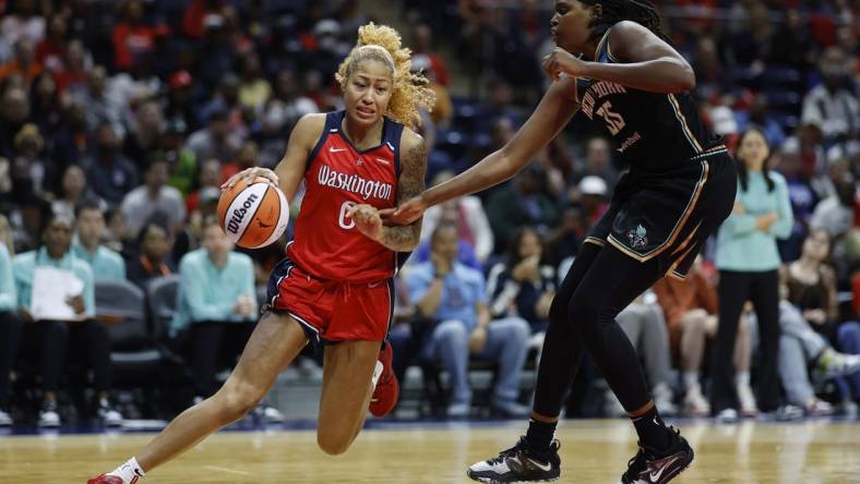 May 19, 2023; Washington, District of Columbia, USA; Washington Mystics center Shakira Austin (0) drives to the basket as New York Liberty forward Jonquel Jones (35) defends in the third quarter at Entertainment & Sports Arena. Mandatory Credit: Geoff Burke-USA TODAY Sports