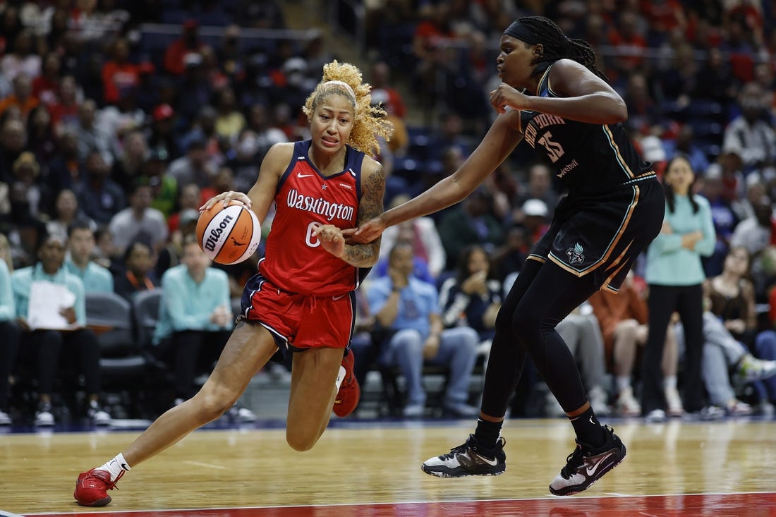 May 19, 2023; Washington, District of Columbia, USA; Washington Mystics center Shakira Austin (0) drives to the basket as New York Liberty forward Jonquel Jones (35) defends in the third quarter at Entertainment & Sports Arena. Mandatory Credit: Geoff Burke-USA TODAY Sports