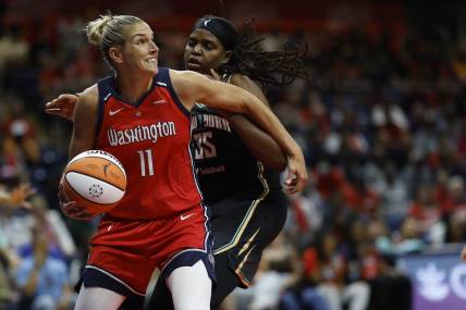 May 19, 2023; Washington, District of Columbia, USA; Washington Mystics forward Elena Delle Donne (11) drives to the basket as New York Liberty forward Jonquel Jones (35) defends in the third quarter at Entertainment & Sports Arena. Mandatory Credit: Geoff Burke-USA TODAY Sports