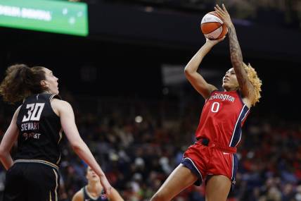 May 19, 2023; Washington, District of Columbia, USA; Washington Mystics center Shakira Austin (0) shoots the ball over New York Liberty forward Breanna Stewart (30) in the third quarter at Entertainment & Sports Arena. Mandatory Credit: Geoff Burke-USA TODAY Sports