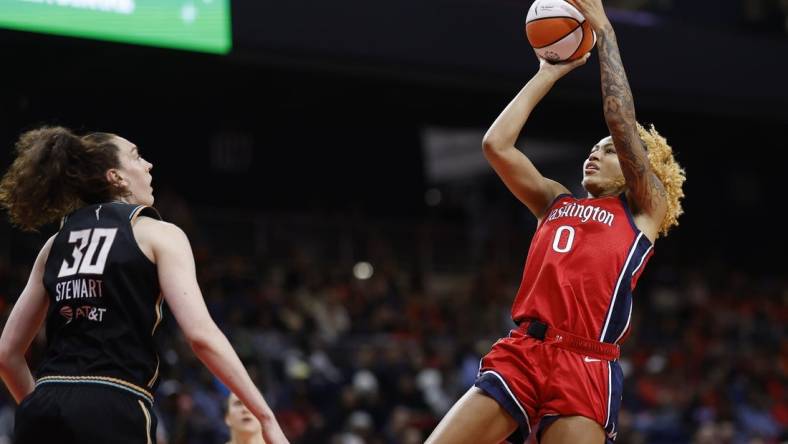 May 19, 2023; Washington, District of Columbia, USA; Washington Mystics center Shakira Austin (0) shoots the ball over New York Liberty forward Breanna Stewart (30) in the third quarter at Entertainment & Sports Arena. Mandatory Credit: Geoff Burke-USA TODAY Sports