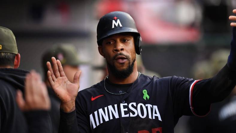 May 20, 2023; Anaheim, California, USA; Minnesota Twins designated hitter Byron Buxton (25) celebrating with teammates in the dugout against Los Angeles Angels during the first inning at Angel Stadium. Mandatory Credit: Jonathan Hui-USA TODAY Sports