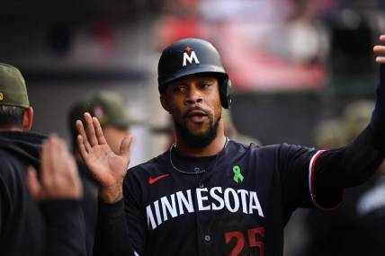 May 20, 2023; Anaheim, California, USA; Minnesota Twins designated hitter Byron Buxton (25) celebrating with teammates in the dugout against Los Angeles Angels during the first inning at Angel Stadium. Mandatory Credit: Jonathan Hui-USA TODAY Sports
