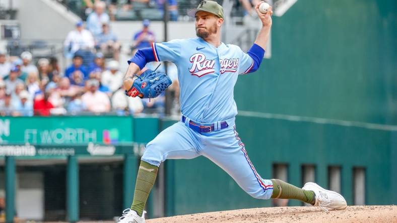 May 21, 2023; Arlington, Texas, USA; Texas Rangers starting pitcher Andrew Heaney (44) throws during the fourth inning against the Colorado Rockies at Globe Life Field. Mandatory Credit: Andrew Dieb-USA TODAY Sports