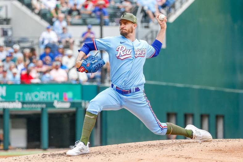 May 21, 2023; Arlington, Texas, USA; Texas Rangers starting pitcher Andrew Heaney (44) throws during the fourth inning against the Colorado Rockies at Globe Life Field. Mandatory Credit: Andrew Dieb-USA TODAY Sports