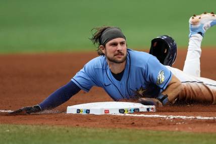 May 21, 2023; St. Petersburg, Florida, USA;  Tampa Bay Rays second baseman Brandon Lowe (8) steals third base against the Milwaukee Brewers in the eight inning at Tropicana Field. Mandatory Credit: Nathan Ray Seebeck-USA TODAY Sports