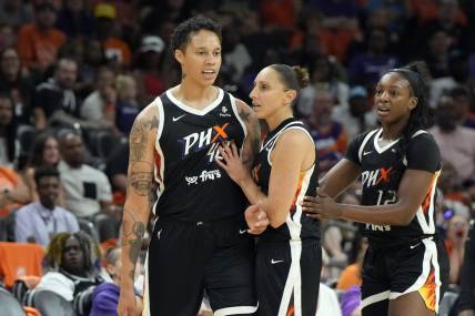 May 21, 2023; Phoenix, Arizona, USA; Phoenix Mercury guard Diana Taurasi (3) holds back Phoenix Mercury center Brittney Griner (42) after a foul call in the second half against the Chicago Sky at Footprint Center. Mandatory Credit: Rick Scuteri-USA TODAY Sports