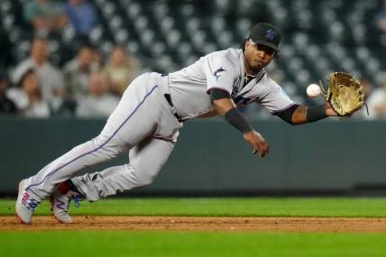 May 23, 2023; Denver, Colorado, USA; Miami Marlins third baseman Jean Segura (9) fields the ball in the sixth inning against the Colorado Rockies at Coors Field. Mandatory Credit: Ron Chenoy-USA TODAY Sports