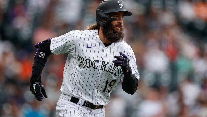 May 25, 2023; Denver, Colorado, USA; Colorado Rockies pinch hitter Charlie Blackmon (19) runs to first on a single in the eighth inning against the Miami Marlins at Coors Field. Mandatory Credit: Isaiah J. Downing-USA TODAY Sports