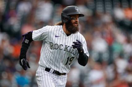 May 25, 2023; Denver, Colorado, USA; Colorado Rockies pinch hitter Charlie Blackmon (19) runs to first on a single in the eighth inning against the Miami Marlins at Coors Field. Mandatory Credit: Isaiah J. Downing-USA TODAY Sports