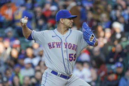 May 25, 2023; Chicago, Illinois, USA; New York Mets starting pitcher Carlos Carrasco (59) pitches against the Chicago Cubs during the first inning at Wrigley Field. Mandatory Credit: Kamil Krzaczynski-USA TODAY Sports