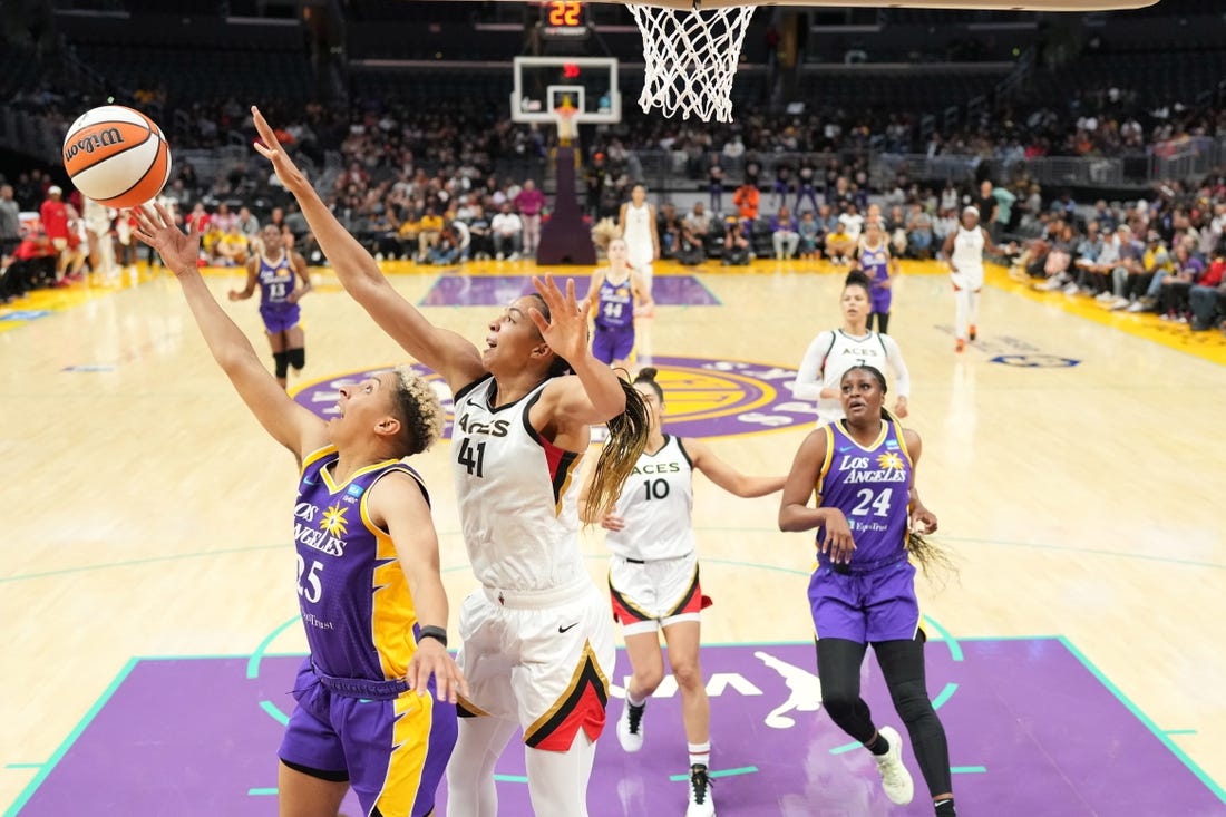 May 25, 2023; Los Angeles, California, USA; LA Sparks guard Layshia Clarendon (25) shoots the ball against Las Vegas Aces center Kiah Stokes (41) during the second half at Crypto.com Arena. Mandatory Credit: Kirby Lee-USA TODAY Sports