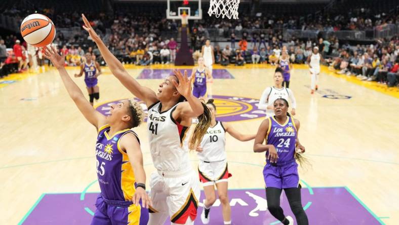 May 25, 2023; Los Angeles, California, USA; LA Sparks guard Layshia Clarendon (25) shoots the ball against Las Vegas Aces center Kiah Stokes (41) during the second half at Crypto.com Arena. Mandatory Credit: Kirby Lee-USA TODAY Sports