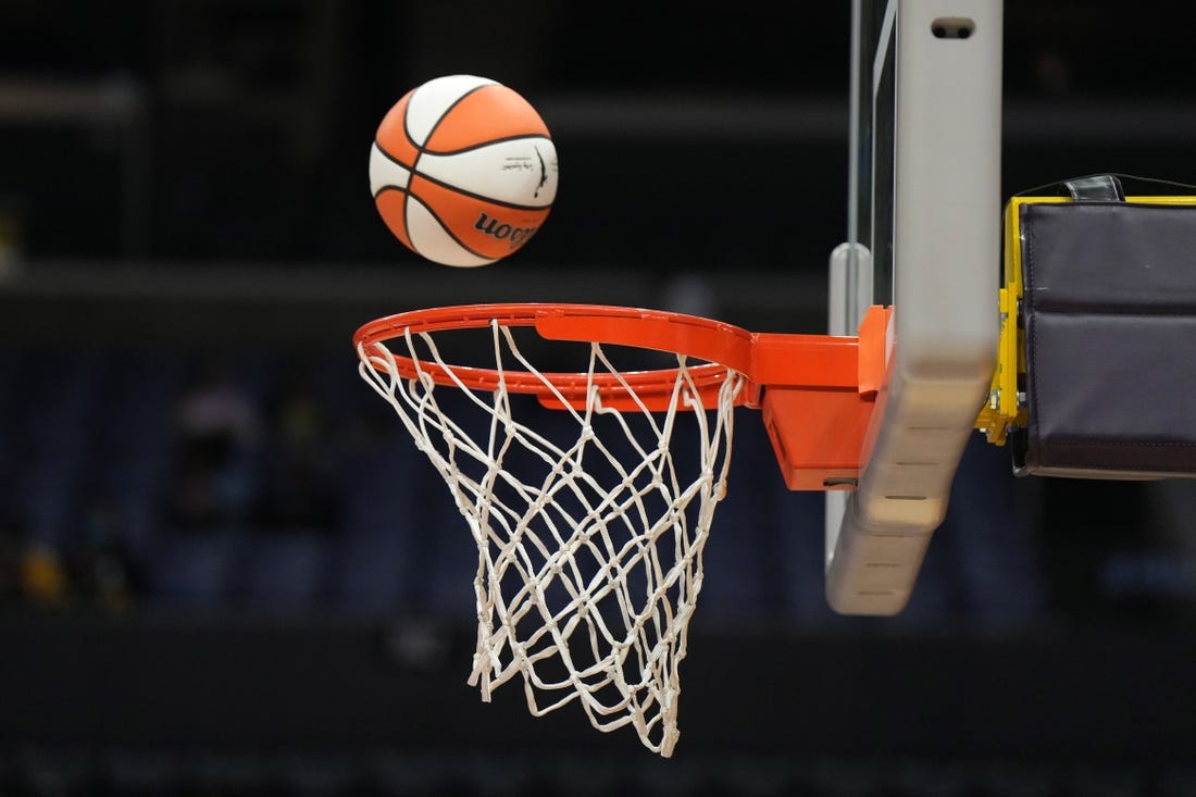 May 25, 2023; Los Angeles, California, USA; Wilson official basketball with WNBA logo goes through the net during the game between the LA Sparks and the Las Vegas Aces at Crypto.com Arena. Mandatory Credit: Kirby Lee-USA TODAY Sports