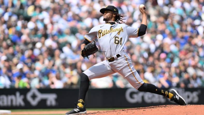 May 27, 2023; Seattle, Washington, USA; Pittsburgh Pirates relief pitcher Jose Hernandez (61) pitches to the Seattle Mariners during the third inning at T-Mobile Park. Mandatory Credit: Steven Bisig-USA TODAY Sports