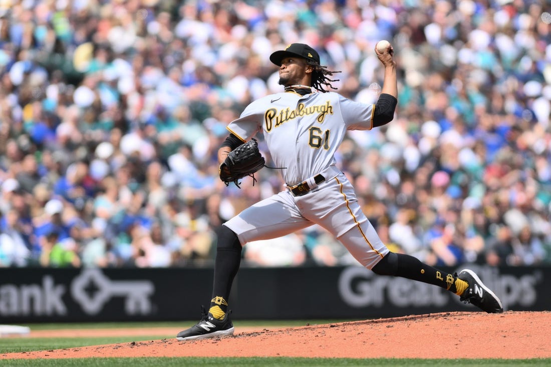 May 27, 2023; Seattle, Washington, USA; Pittsburgh Pirates relief pitcher Jose Hernandez (61) pitches to the Seattle Mariners during the third inning at T-Mobile Park. Mandatory Credit: Steven Bisig-USA TODAY Sports