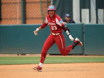 Oklahoma's Tiare Jennings (23) celebrates her game-winning run in the ninth inning during the NCAA Norman Super Regional softball game between the University of Oklahoma Sooners and the Clemson Tigers at Marita Hynes Field in Norman, Okla., Saturday, May, 27, 2023.