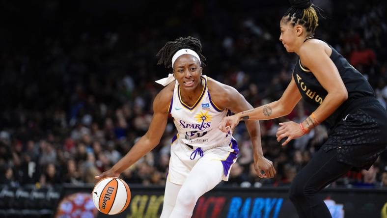 May 27, 2023; Las Vegas, Nevada, USA; Los Angeles Sparks forward Nneka Ogwumike (30) dribbles the ball against Las Vegas Aces forward/center Candace Parker (3) during the third quarter at Michelob Ultra Arena. Mandatory Credit: Lucas Peltier-USA TODAY Sports