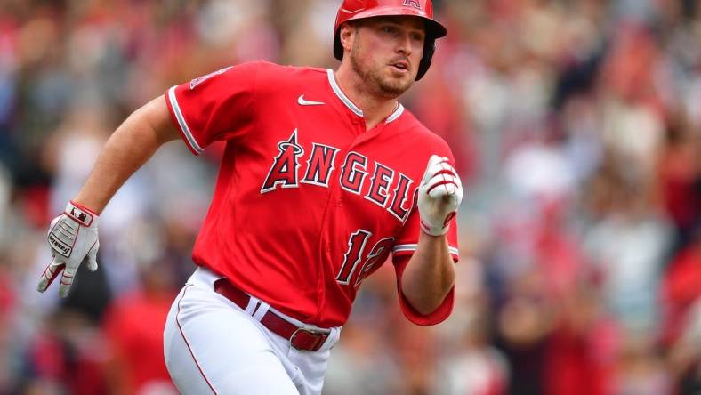 May 28, 2023; Anaheim, California, USA; Los Angeles Angels right fielder Hunter Renfroe (12) runs after hitting a double against the Miami Marlins during the ninth inning at Angel Stadium. Mandatory Credit: Gary A. Vasquez-USA TODAY Sports