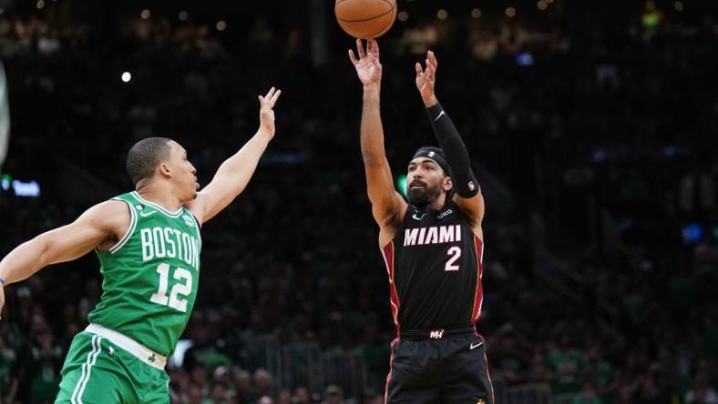 May 29, 2023; Boston, Massachusetts, USA; Miami Heat guard Gabe Vincent (2) shoots a three pointer against Boston Celtics forward Grant Williams (12) in the second quarter during game seven of the Eastern Conference Finals for the 2023 NBA playoffs at TD Garden. Mandatory Credit: David Butler II-USA TODAY Sports