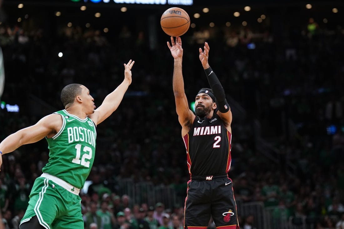 May 29, 2023; Boston, Massachusetts, USA; Miami Heat guard Gabe Vincent (2) shoots a three pointer against Boston Celtics forward Grant Williams (12) in the second quarter during game seven of the Eastern Conference Finals for the 2023 NBA playoffs at TD Garden. Mandatory Credit: David Butler II-USA TODAY Sports