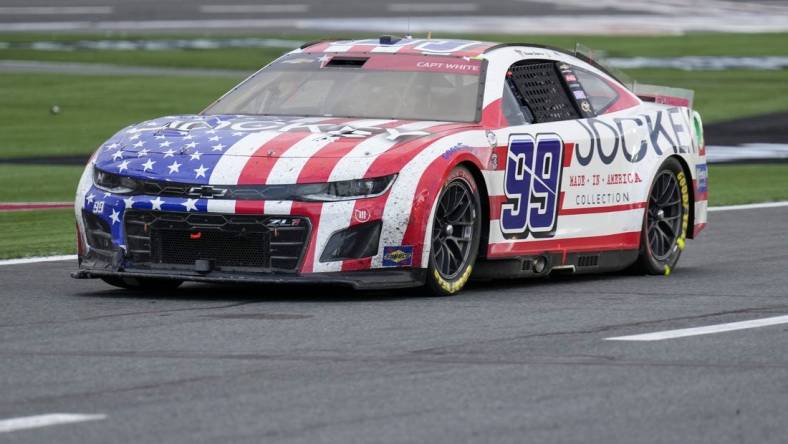 May 29, 2023; Concord, North Carolina, USA; NASCAR Cup Series driver Daniel Suarez (99) on pit road during the Coca-Cola 600 at Charlotte Motor Speedway. Mandatory Credit: Jim Dedmon-USA TODAY Sports