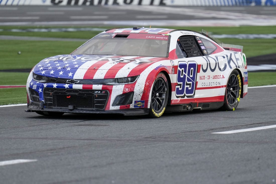 May 29, 2023; Concord, North Carolina, USA; NASCAR Cup Series driver Daniel Suarez (99) on pit road during the Coca-Cola 600 at Charlotte Motor Speedway. Mandatory Credit: Jim Dedmon-USA TODAY Sports