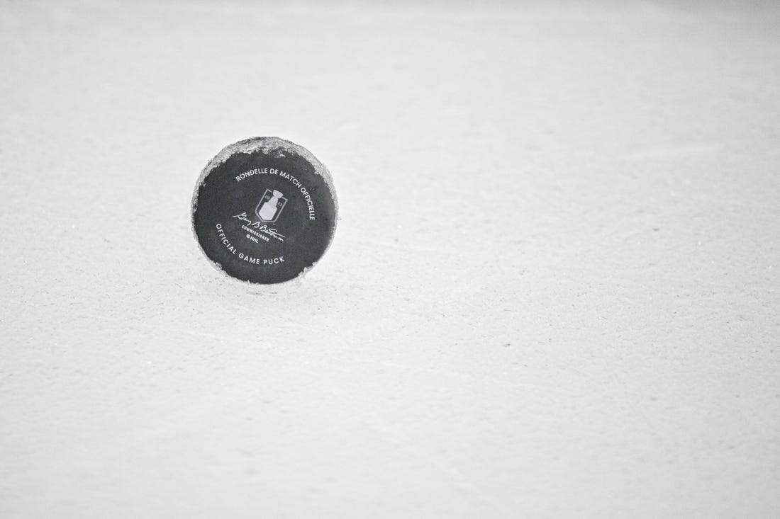 May 29, 2023; Dallas, Texas, USA; A view of an NHL puck with the Stanley Cup logo on the ice during the first period between the Dallas Stars and the Vegas Golden Knights in game six of the Western Conference Finals of the 2023 Stanley Cup Playoffs at American Airlines Center. Mandatory Credit: Jerome Miron-USA TODAY Sports