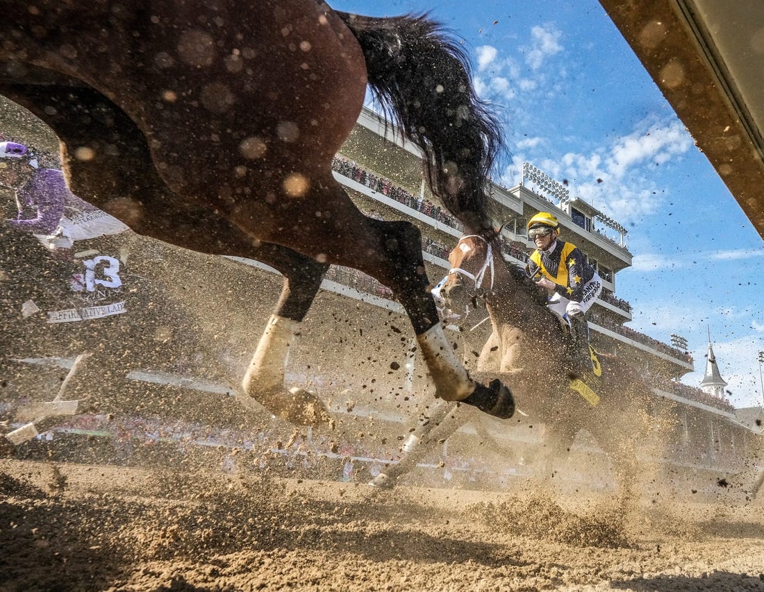 The field for the 149th Running of the Kentucky Oak makes their way past the grandstands at Churchill Downs on May 5, 2023