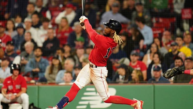 May 30, 2023; Boston, Massachusetts, USA; Boston Red Sox center fielder Raimel Tapia (17) gets a hit to drive in a. Run against the Cincinnati Reds in the ninth inning at Fenway Park. Mandatory Credit: David Butler II-USA TODAY Sports