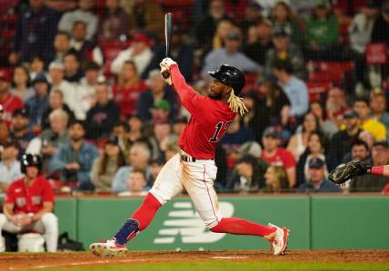 May 30, 2023; Boston, Massachusetts, USA; Boston Red Sox center fielder Raimel Tapia (17) gets a hit to drive in a. Run against the Cincinnati Reds in the ninth inning at Fenway Park. Mandatory Credit: David Butler II-USA TODAY Sports