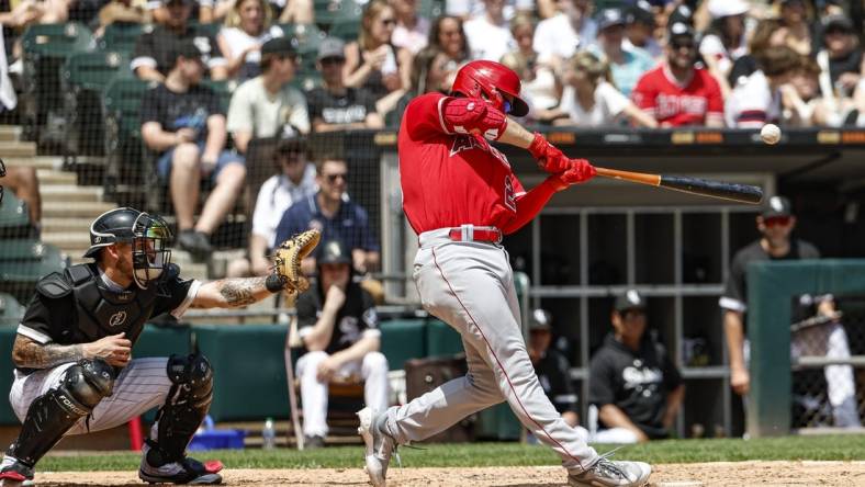 May 31, 2023; Chicago, Illinois, USA; Los Angeles Angels first baseman Jared Walsh (20) hits a two-run double against the Chicago White Sox during the third inning at Guaranteed Rate Field. Mandatory Credit: Kamil Krzaczynski-USA TODAY Sports