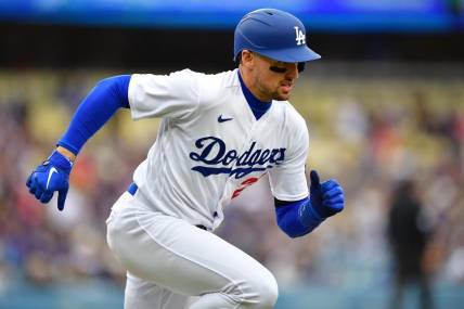 May 31, 2023; Los Angeles, California, USA; Los Angeles Dodgers center fielder Trayce Thompson (25) runs after hitting a single against the Washington Nationals during the fourth inning at Dodger Stadium. Mandatory Credit: Gary A. Vasquez-USA TODAY Sports