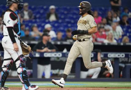 Jun 1, 2023; Miami, Florida, USA;  San Diego Padres right fielder Fernando Tatis Jr. (23) scores a run in the fourth inning against the Miami Marlins at loanDepot Park. Mandatory Credit: Jim Rassol-USA TODAY Sports