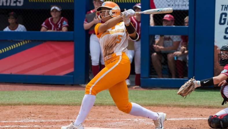 Jun 1, 2023; Oklahoma City, OK, USA;  Tennessee Lady Vols left fielder Rylie West (5) watches her home run in the fourth inning against the Alabama Crimson Tide during the Womens College World Series at USA Softball Hall of Fame Stadium. Mandatory Credit: Brett Rojo-USA TODAY Sports