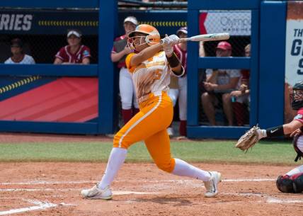 Jun 1, 2023; Oklahoma City, OK, USA;  Tennessee Lady Vols left fielder Rylie West (5) watches her home run in the fourth inning against the Alabama Crimson Tide during the Womens College World Series at USA Softball Hall of Fame Stadium. Mandatory Credit: Brett Rojo-USA TODAY Sports