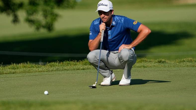 June 1, 2023; Dublin, Ohio, USA;  Davis Riley lines up a putt on the ninth hole during the opening round of the Memorial Tournament at Muirfield Village Golf Club. Riley made a birdie to become the leader in the clubhouse at -5.