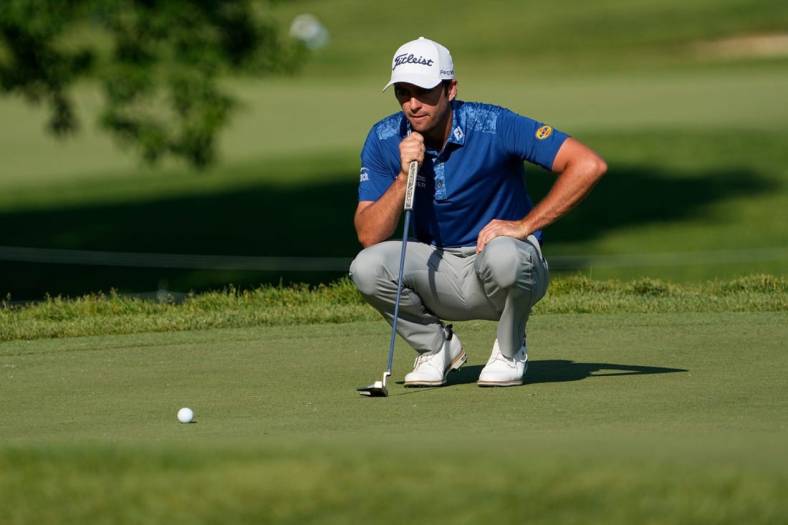 June 1, 2023; Dublin, Ohio, USA;  Davis Riley lines up a putt on the ninth hole during the opening round of the Memorial Tournament at Muirfield Village Golf Club. Riley made a birdie to become the leader in the clubhouse at -5.