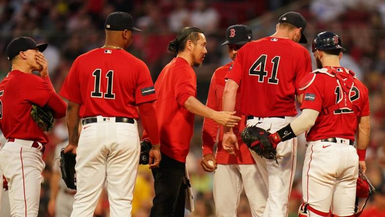 Jun 1, 2023; Boston, Massachusetts, USA; Boston Red Sox manager Alex Cora (13) relieves starting pitcher Chris Sale (41) during a timeout against the Cincinnati Reds in the fourth inning at Fenway Park. Mandatory Credit: David Butler II-USA TODAY Sports