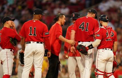 Jun 1, 2023; Boston, Massachusetts, USA; Boston Red Sox manager Alex Cora (13) relieves starting pitcher Chris Sale (41) during a timeout against the Cincinnati Reds in the fourth inning at Fenway Park. Mandatory Credit: David Butler II-USA TODAY Sports