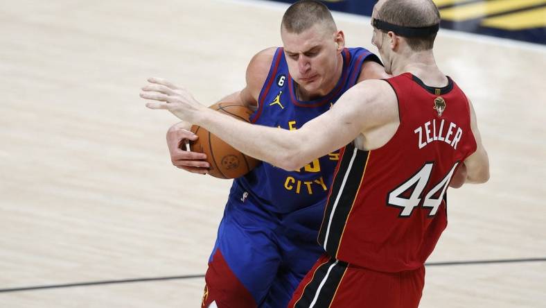 Jun 1, 2023; Denver, CO, USA; Denver Nuggets center Nikola Jokic (15) goes to the basket while defended by Miami Heat center Cody Zeller (44) during the second quarter in game one of the 2023 NBA Finals at Ball Arena. Mandatory Credit: Isaiah J. Downing-USA TODAY Sports