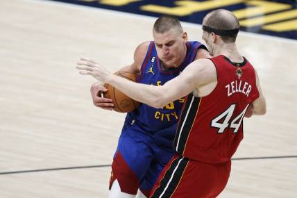Jun 1, 2023; Denver, CO, USA; Denver Nuggets center Nikola Jokic (15) goes to the basket while defended by Miami Heat center Cody Zeller (44) during the second quarter in game one of the 2023 NBA Finals at Ball Arena. Mandatory Credit: Isaiah J. Downing-USA TODAY Sports