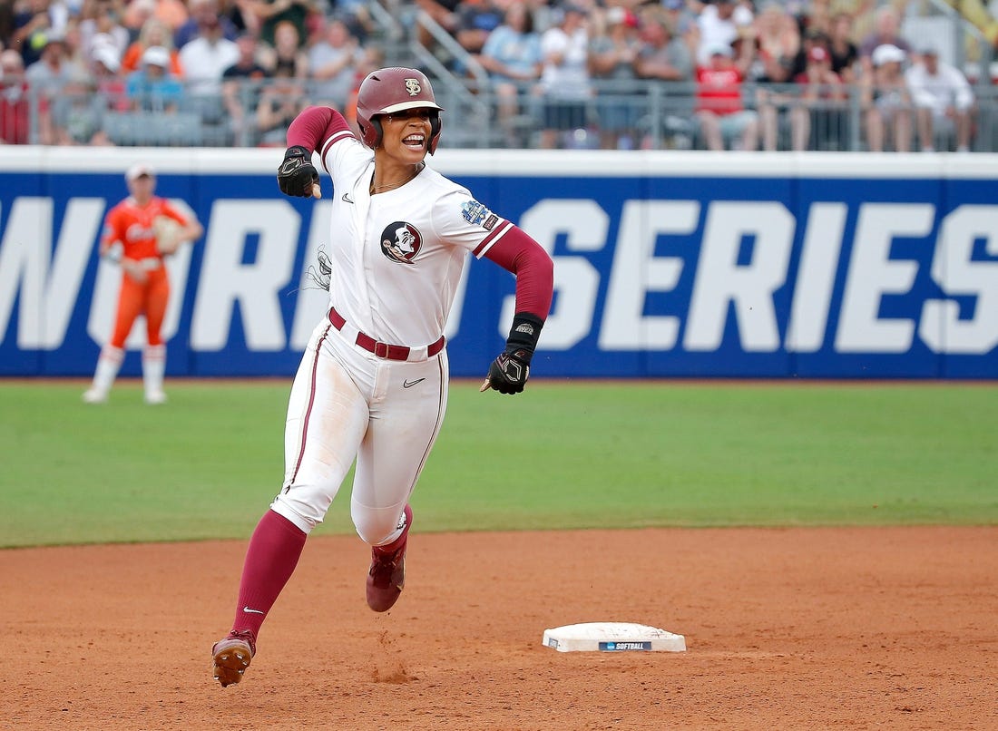 Florida State.'s Michaela Edenfield (51) celebrates a home run in the first inning during a softball game between Oklahoma State Cowgirls and Florida State in the Women's College World Series at USA Softball Hall of Fame Stadium in  in Oklahoma City, Thursday, June, 1, 2023.