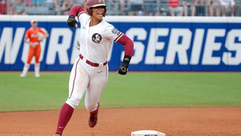 Florida State.'s Michaela Edenfield (51) celebrates a home run in the first inning during a softball game between Oklahoma State Cowgirls and Florida State in the Women's College World Series at USA Softball Hall of Fame Stadium in  in Oklahoma City, Thursday, June, 1, 2023.