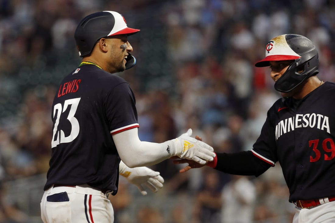 Jun 1, 2023; Minneapolis, Minnesota, USA; Minnesota Twins third baseman Royce Lewis celebrates his two-run home run against the Cleveland Guardians with designated hitter Donovan Solano (39) in the eighth inning at Target Field. Mandatory Credit: Bruce Kluckhohn-USA TODAY Sports